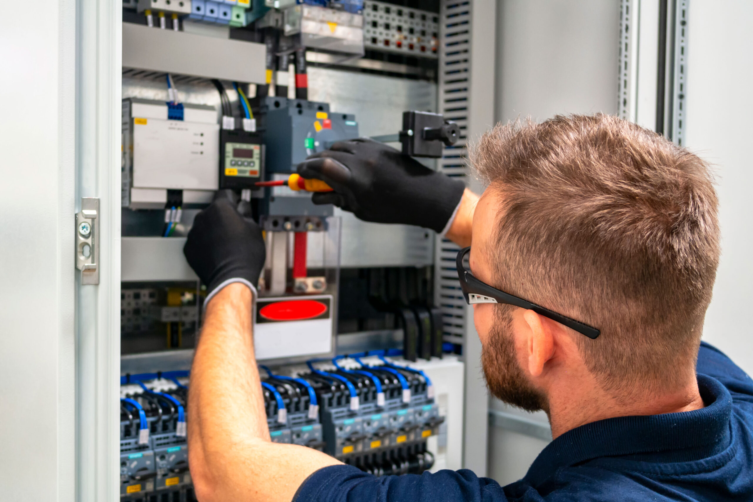 electrician working on panel