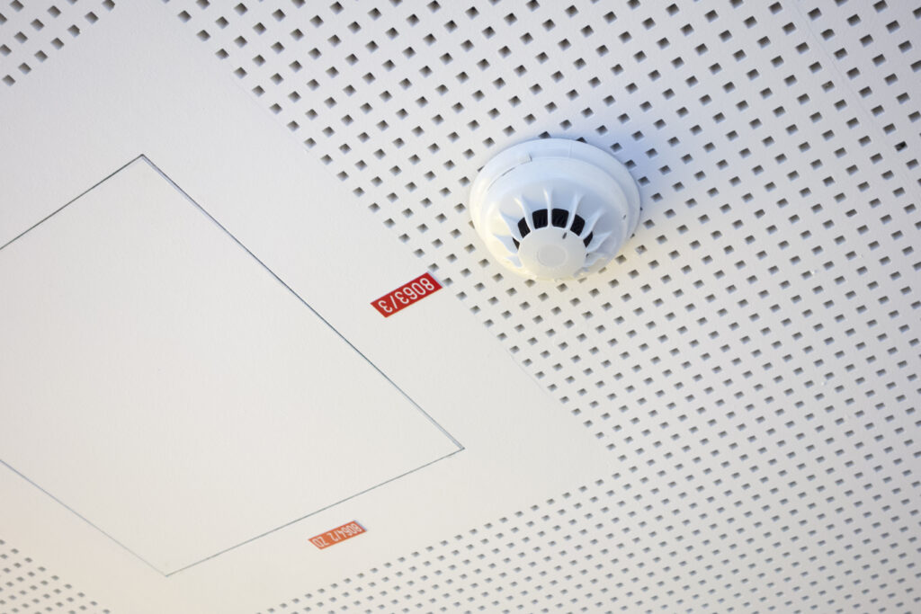 Commercial ceiling with a fire evacuation and alarm system fitted
